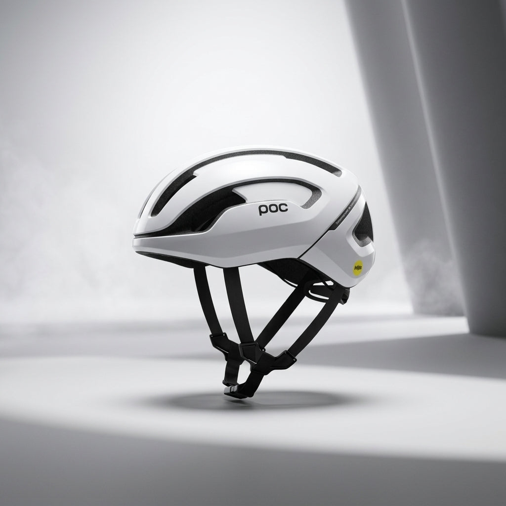 White bicycle helmet with black accents on a light gray background
