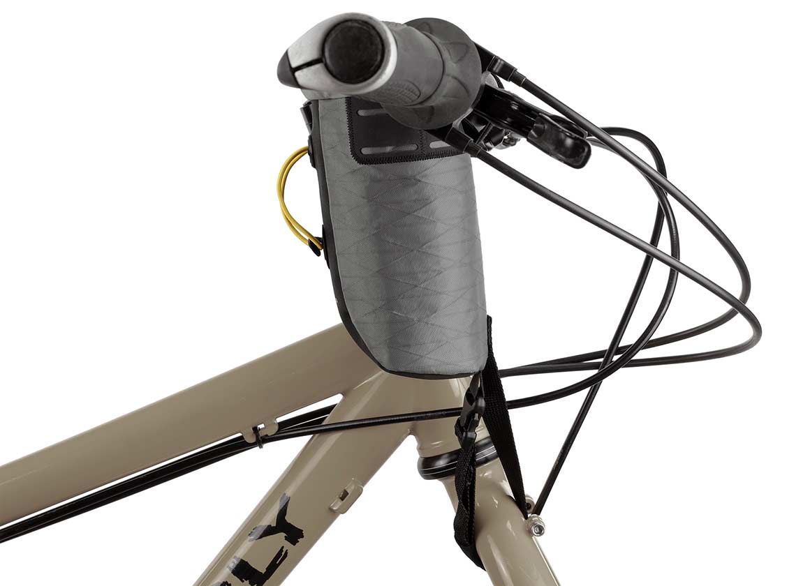 Apidura Backcountry Food Pouch on bike handlebars