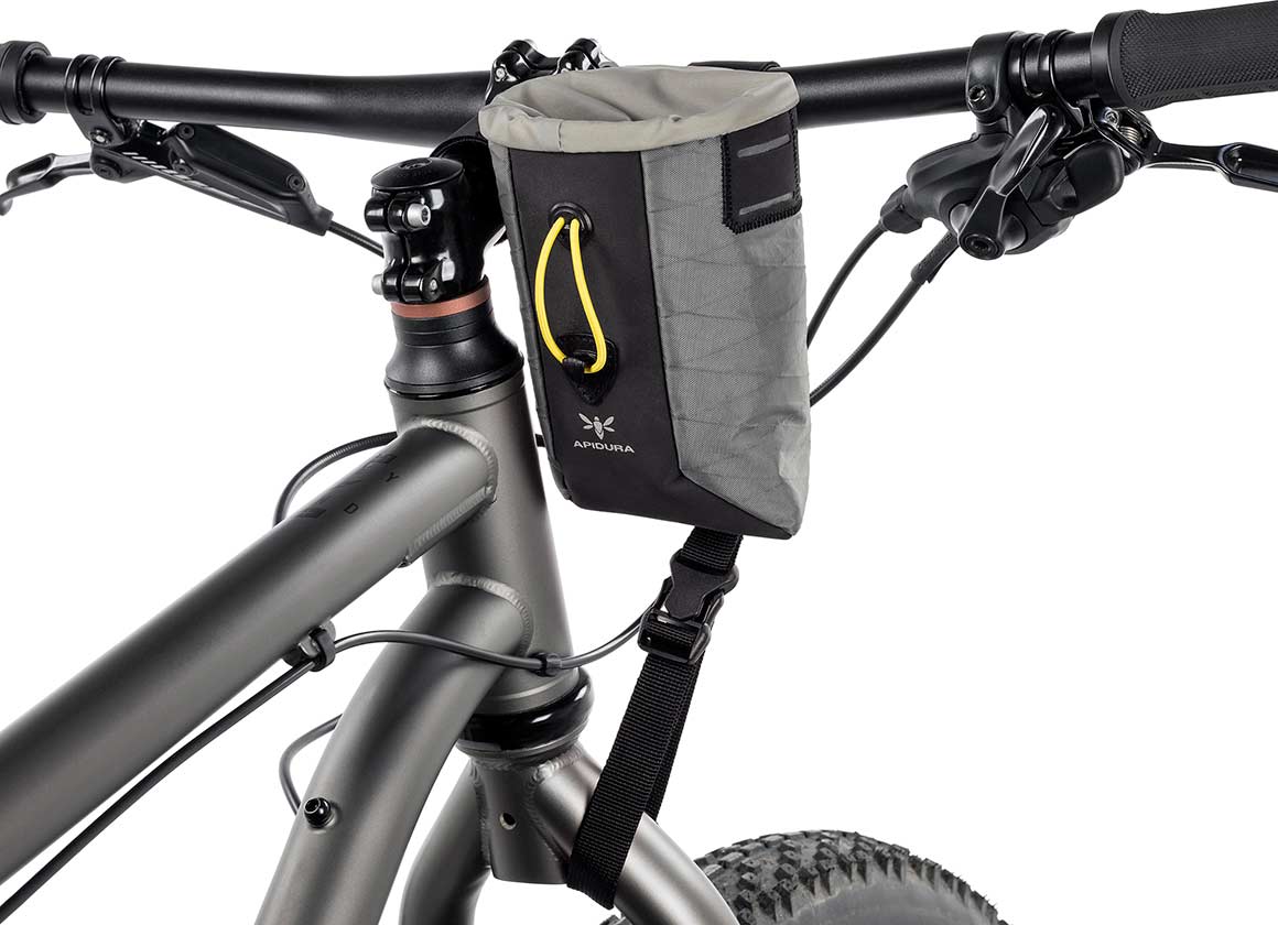Apidura Backcountry Food Pouch on bike handlebars