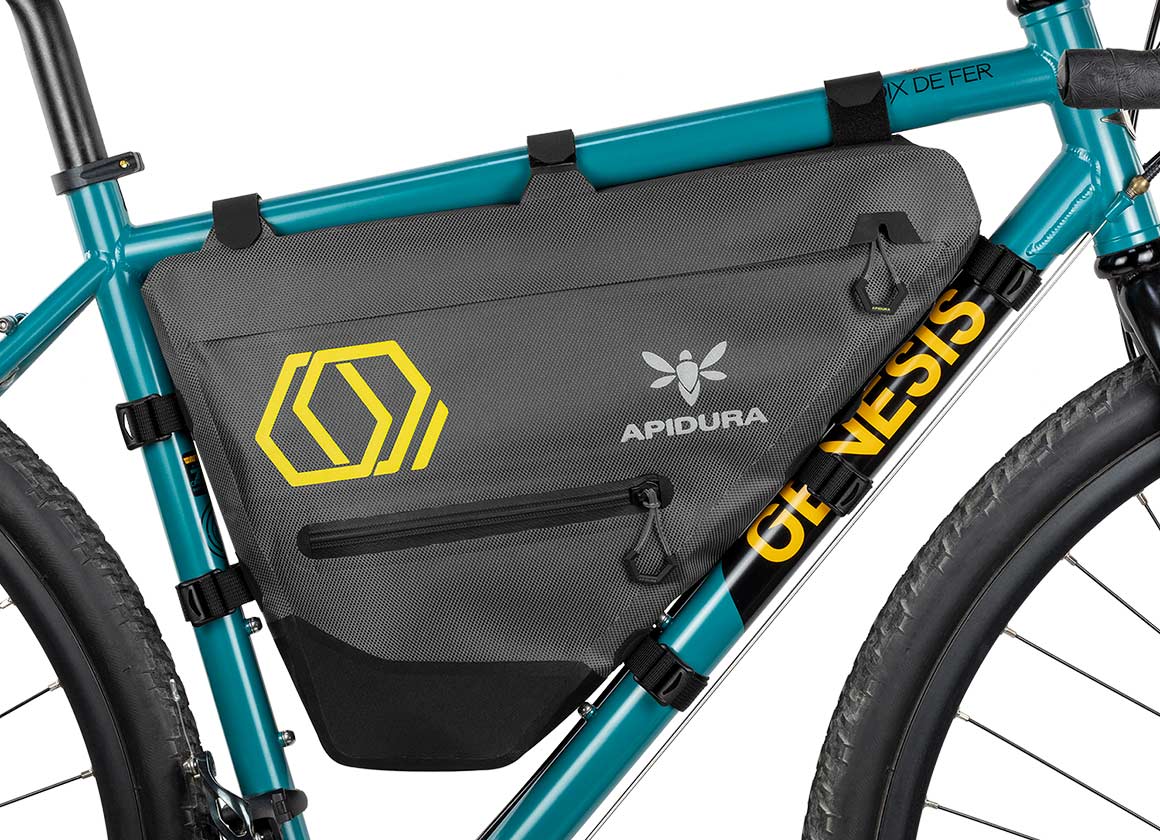 Apidura Full Frame Bag on a bikes bar with a white background