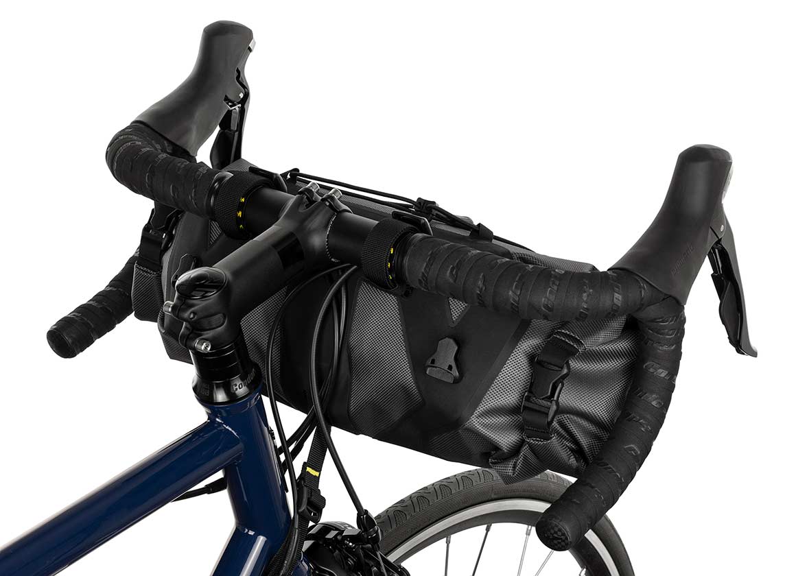 Apidura Handlebar Bag on front of handlebars from behind