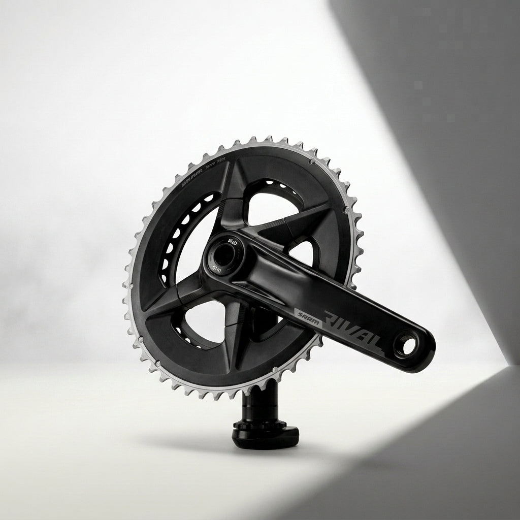 Bottle attached to middle bar of a bike with bontrager across the bar and a blurred background