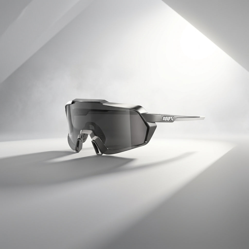 Black sunglasses with a reflective lens on a light gray background