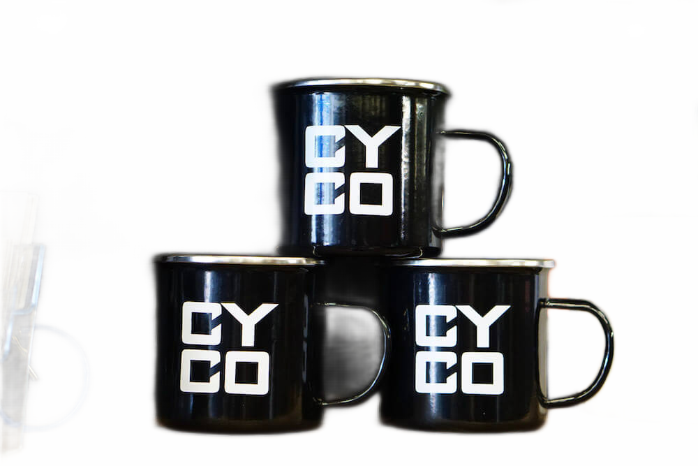 CYCO Bikes Enamel Mug, three mugs stacked on a wooden bench
